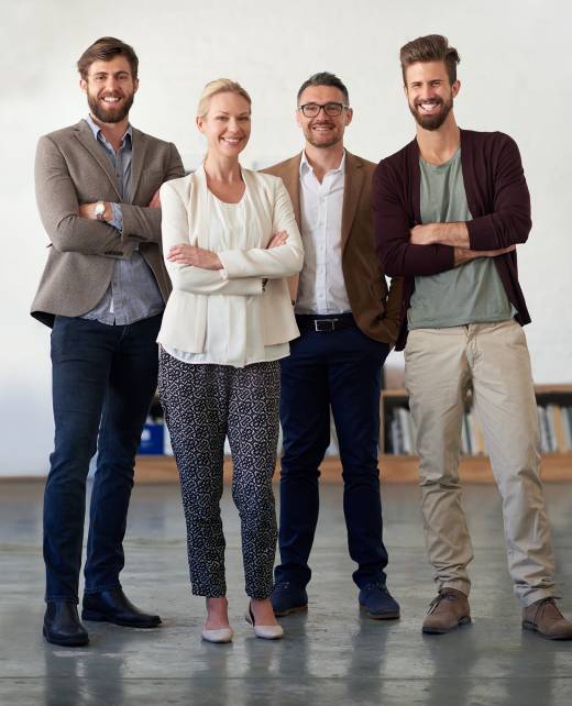 Group of contemporary creative professionals in an open office space.